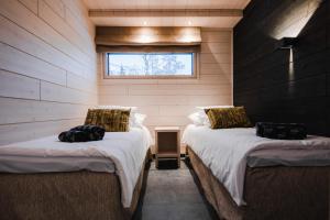 Кровать или кровати в номере Parkside Pyhä