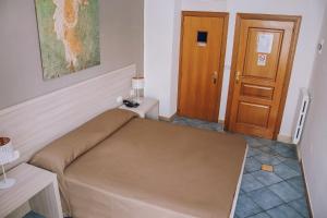 Postel nebo postele na pokoji v ubytování Hotel Piccolo Sogno