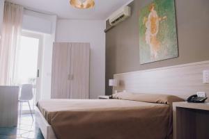 Postel nebo postele na pokoji v ubytování Hotel Piccolo Sogno
