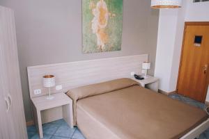Postel nebo postele na pokoji v ubytování Hotel Piccolo Sogno