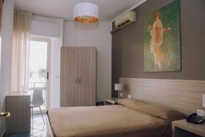 Postel nebo postele na pokoji v ubytování Hotel Piccolo Sogno