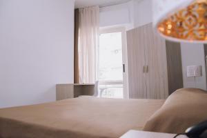 Postel nebo postele na pokoji v ubytování Hotel Piccolo Sogno