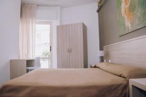 Postel nebo postele na pokoji v ubytování Hotel Piccolo Sogno