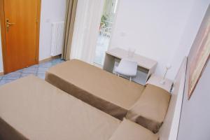 Postel nebo postele na pokoji v ubytování Hotel Piccolo Sogno