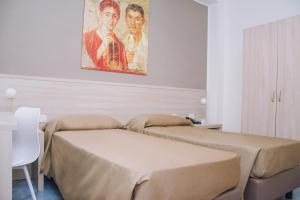 Postel nebo postele na pokoji v ubytování Hotel Piccolo Sogno