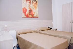 Postel nebo postele na pokoji v ubytování Hotel Piccolo Sogno