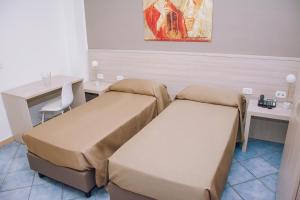 Postel nebo postele na pokoji v ubytování Hotel Piccolo Sogno