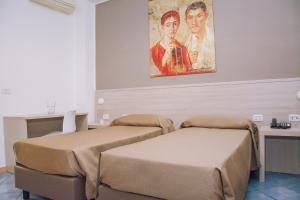 Postel nebo postele na pokoji v ubytování Hotel Piccolo Sogno