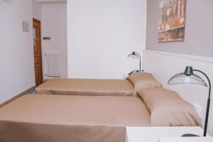 Postel nebo postele na pokoji v ubytování Hotel Piccolo Sogno