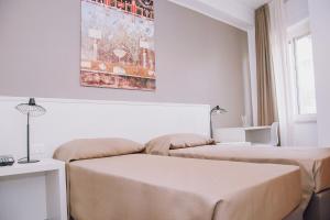 Postel nebo postele na pokoji v ubytování Hotel Piccolo Sogno