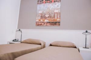 Postel nebo postele na pokoji v ubytování Hotel Piccolo Sogno