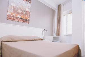 Postel nebo postele na pokoji v ubytování Hotel Piccolo Sogno