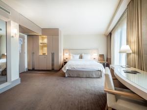 Postel nebo postele na pokoji v ubytování Hôtel Le Pré Carré