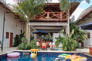 a group of people in the pool at a resort at La Vaina Cali in Cali