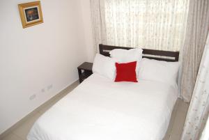 Ένα ή περισσότερα κρεβάτια σε δωμάτιο στο Lonjeta Self-Catering Apartments
