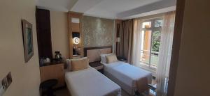 Katil atau katil-katil dalam bilik di Elysian Resort