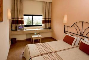 Ein Bett oder Betten in einem Zimmer der Unterkunft Sufetula Hotel