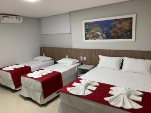 Een bed of bedden in een kamer bij Summit Pousada Noah