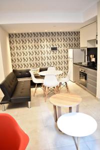 a living room with a couch and a table and chairs at Loft para 4 personas 1º C in Buenos Aires