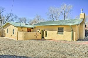 a house with a green roof and a garage at Spacious Adobe Home Less Than 1 Mi to Downtown Taos! in Taos