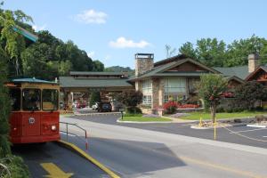 a trolley car on a street in a town at Greystone Lodge on the River in Gatlinburg