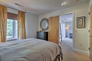 a bedroom with a large bed and a mirror at LoHi Apartment with Patio 1 Mi to Downtown Denver! in Denver