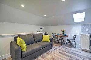 a living room with a couch and a table at Dtwn Golden Apt Less Than 9 Mi to Red Rocks Amphitheater! in Golden