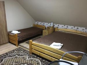 Postel nebo postele na pokoji v ubytování Harsányi vendégház