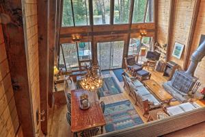 an overhead view of a living room in a log cabin at Lakefront Berkshires Retreat with Deck, Dock and Boat! in Great Barrington