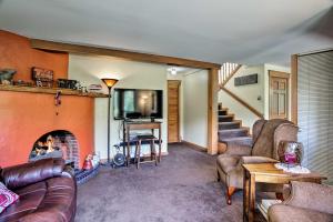 a living room with couches and a fireplace at Cozy Home with Deck and Mountain Views, Walk to Casinos in Central City