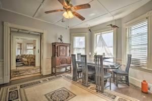 a dining room with a ceiling fan and a table and chairs at Quaint Beverly Townhome Walk to Beach and Downtown! in Beverly