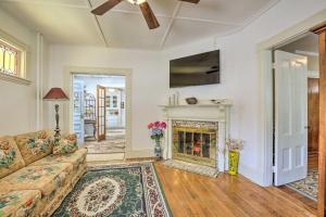a living room with a couch and a fireplace at Quaint Beverly Townhome Walk to Beach and Downtown! in Beverly