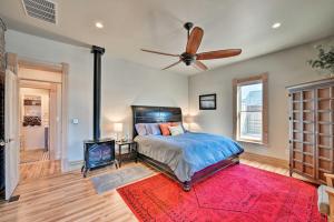 a bedroom with a bed and a ceiling fan at Downtown Salida Home, 1 Block to Main Street, 0547 in Salida