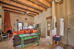 a living room with a couch and a table at Adobe House with Patio - 1 half Mi to Santa Fe Plaza! in Santa Fe