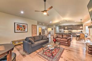 a living room with two couches and a table at Charming Buena Vista Home about 1 Block to Main Street in Buena Vista