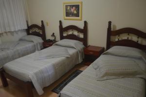 Postel nebo postele na pokoji v ubytování Hotel Obino São Borja