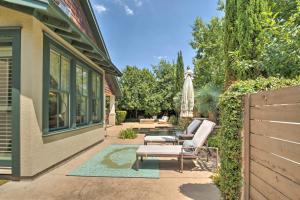 a patio with two chairs and a table at Pool and Hot Tub Ideally Located Austin Oasis in Austin