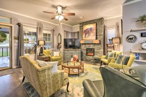 a living room filled with furniture and a fireplace at Cozy Bearadise Bungalow 2 Mi to Magnolia Market! in Waco