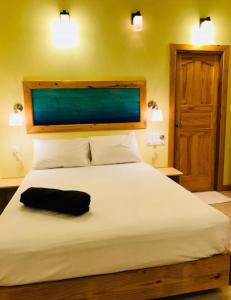 Postel nebo postele na pokoji v ubytování Royal Reef Stay