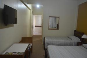 Postel nebo postele na pokoji v ubytování Hotel Obino São Borja