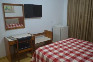 Postel nebo postele na pokoji v ubytování Hotel Obino São Borja