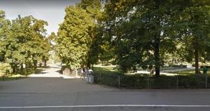 a park with a fence and trees and a street at El Dorado Apartment z Jacuzzi in Wrocław