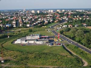 an aerial view of a building and a highway at Hotel Reg Benz in Mielec