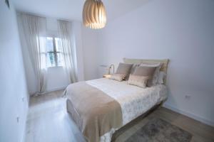 Posteľ alebo postele v izbe v ubytovaní El Apartamento de Rosi