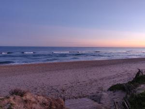 a view of the beach at sunset at Studio Naturiste Design in Cap d'Agde