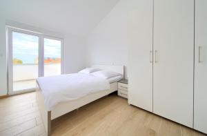 Postel nebo postele na pokoji v ubytování Adria House