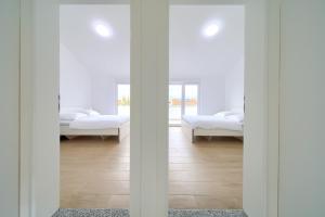 Postel nebo postele na pokoji v ubytování Adria House