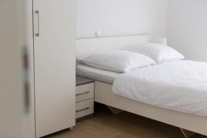 Postel nebo postele na pokoji v ubytování Adria House