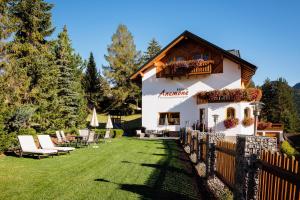 a house with a fence in front of a yard at Haus Anemone in Serfaus