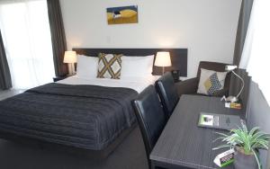 Postel nebo postele na pokoji v ubytování Airport Palms Motel